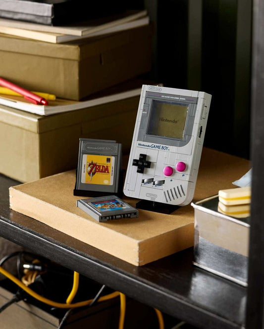 VaultifyUK LEGO Super Mario Game Boy brick-built replica with retro game cartridges displayed on a desk