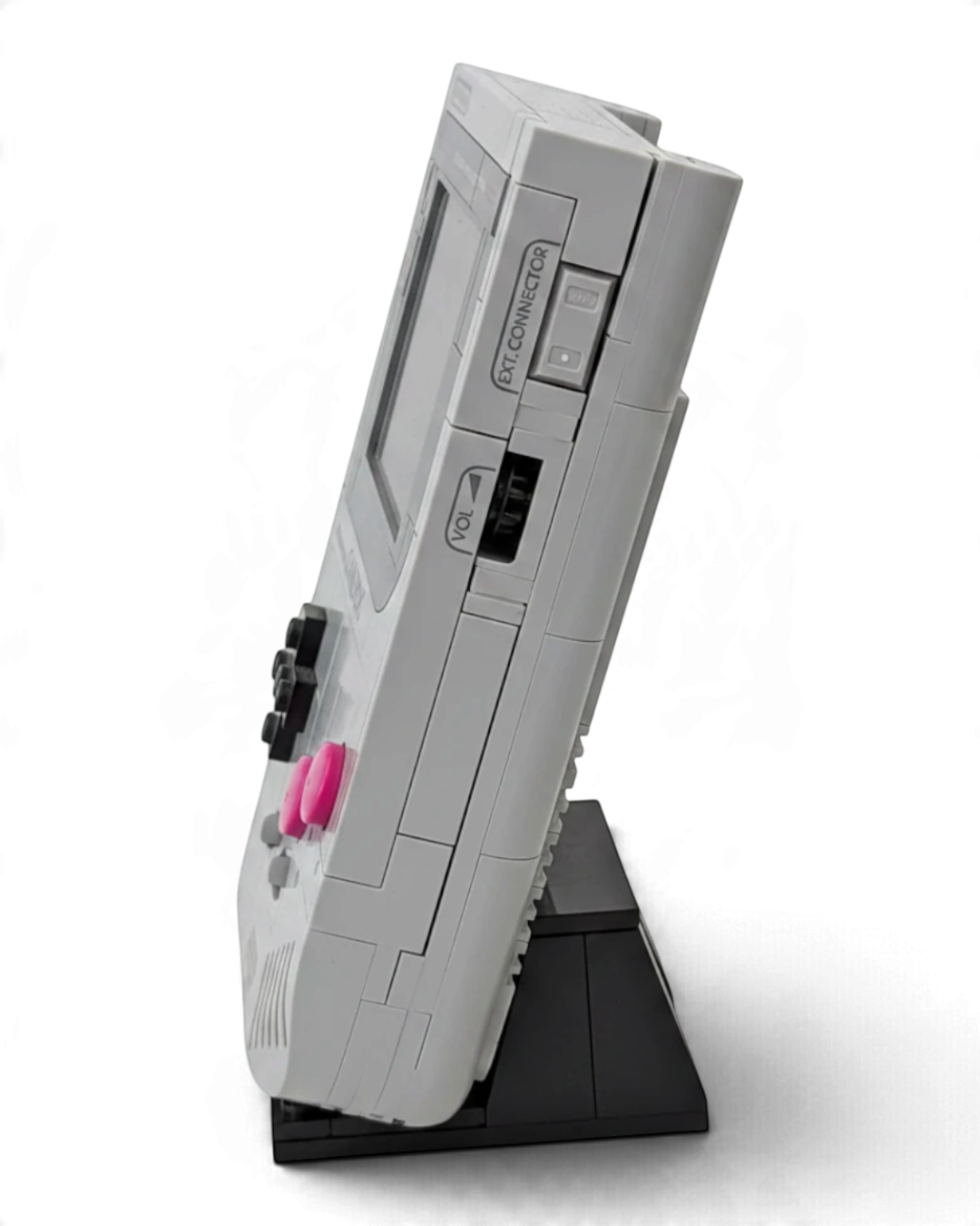VaultifyUK LEGO Super Mario Game Boy 72046 set displayed on a black stand, showing side profile and control buttons.