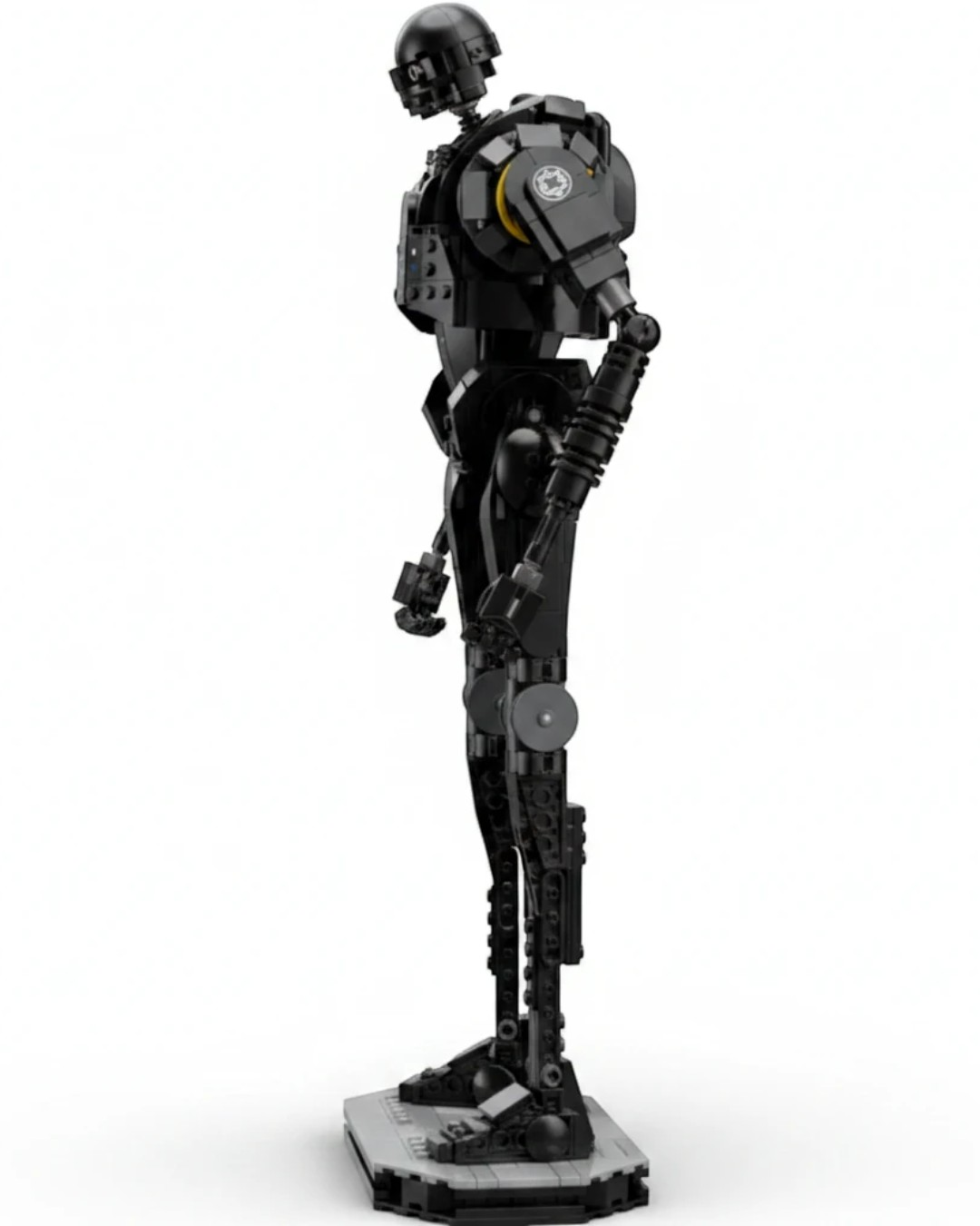 VaultifyUK LEGO Star Wars K-2SO security droid model standing on a display base, side profile view.