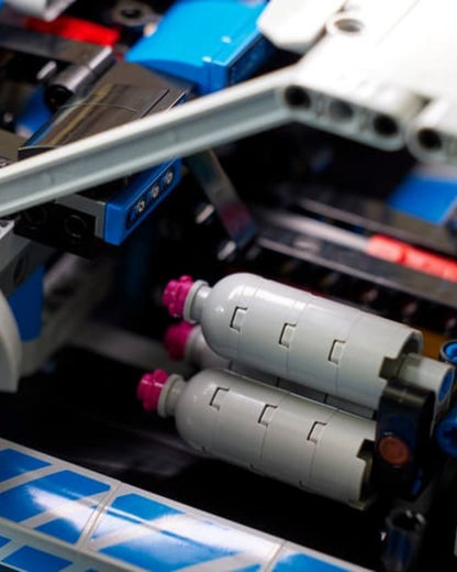 VaultifyUK LEGO Technic Nissan Skyline GT-R R34 interior detail showing nitrous oxide bottles in the passenger seat