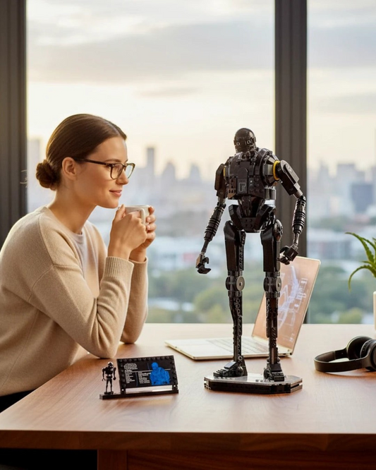 VaultifyUK LEGO Star Wars K-2SO droid model on a desk with a woman in a bright office setting