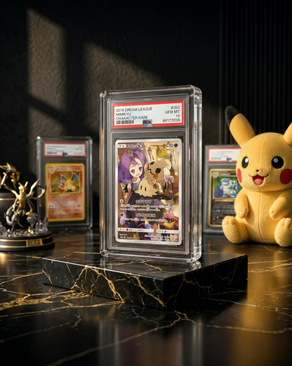VaultifyUK magnetic clear acrylic display case holding a PSA graded Mimikyu Pokemon card on a black marble surface.