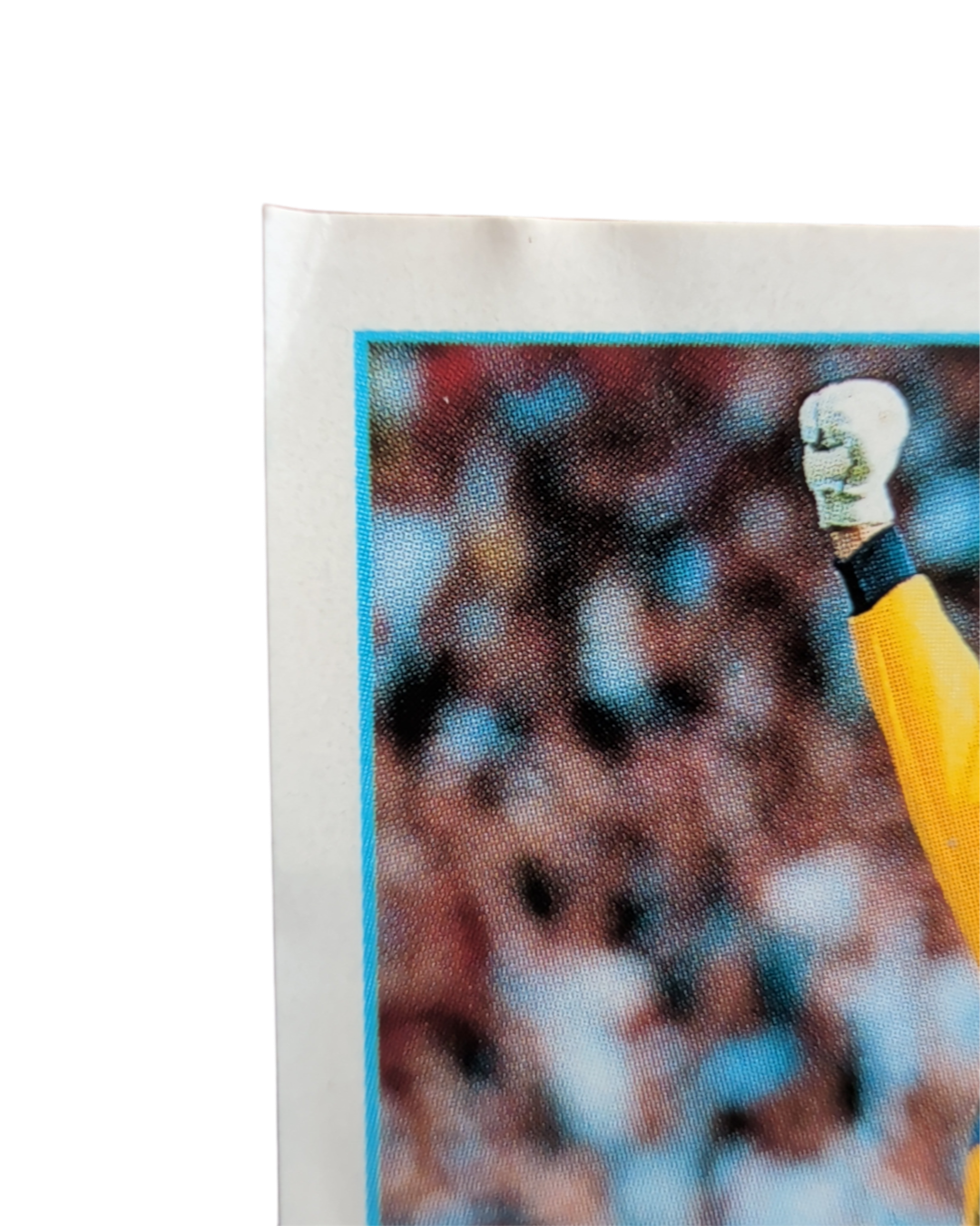 Close-up of the top-left corner of the Merlin Premier League 97 England Poster sticker E, showing print condition.