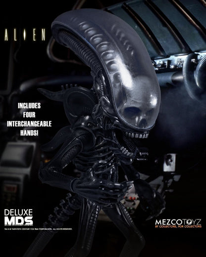VaultifyUK Mezco Designer Series Alien Xenomorph action figure with glossy black biomechanical detail and domed head