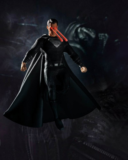 VaultifyUK Mezco One:12 Collective Superman figure in black suit with heat vision eye effects from Justice League