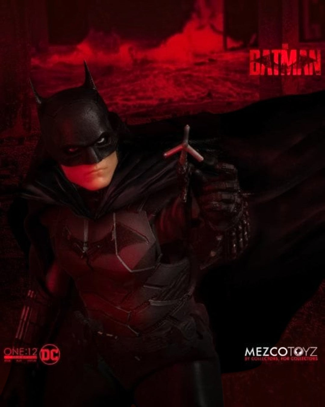 VaultifyUK Mezco One:12 Collective The Batman action figure in a tactical black suit against a moody red background