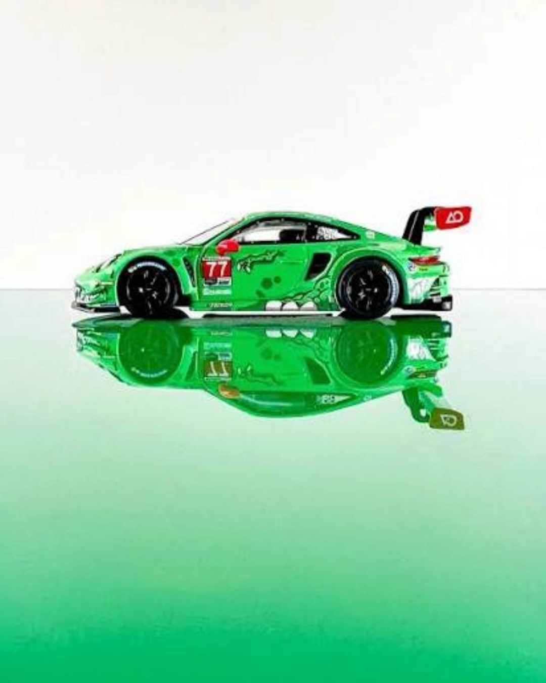VaultifyUK MINI GT Porsche 911 GT3 R Rexy diecast model in green T-Rex livery from the 2024 Daytona 24 Hours