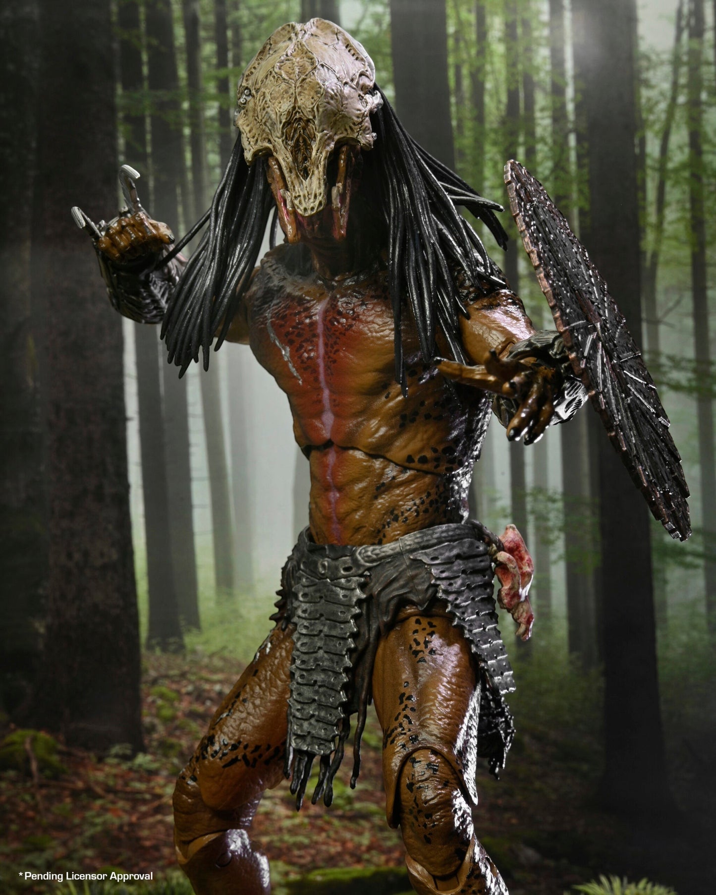 VaultifyUK NECA Prey Feral Predator 7-inch action figure with bone mask and shield in a forest setting