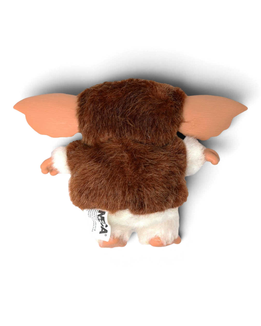 VaultifyUK 6-inch NECA Gremlins Gizmo plush toy seen from the back, featuring brown fur and large vinyl ears.