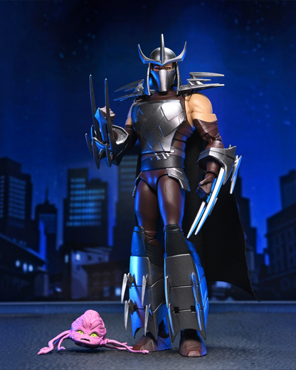 VaultifyUK NECA TMNT 2012 Shredder action figure with metallic armor, fabric cape, and a small pink Kraang figure.
