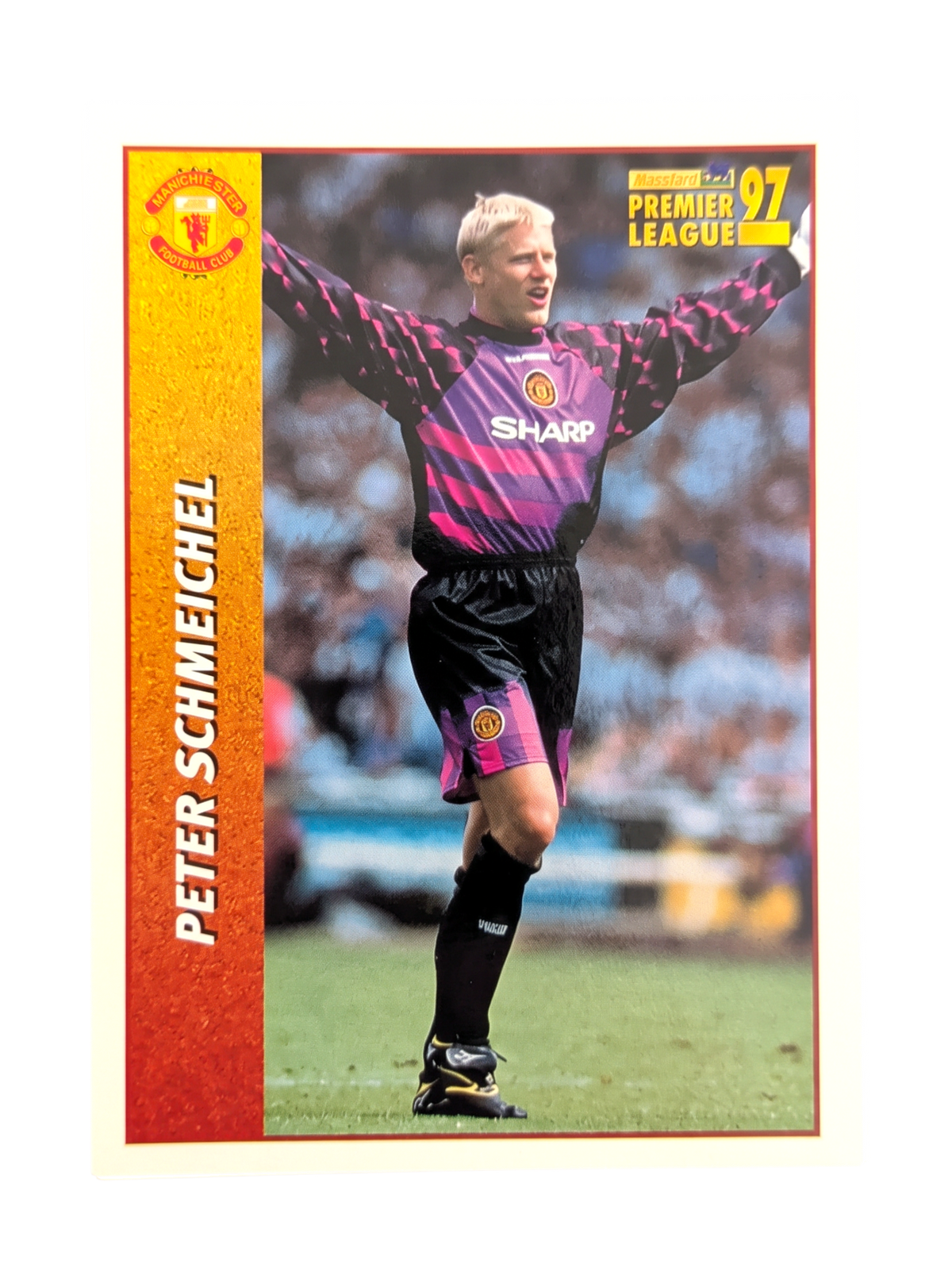 VaultifyUK 1997 Merlin Peter Schmeichel Manchester United football sticker in purple and pink Sharp goalkeeper kit