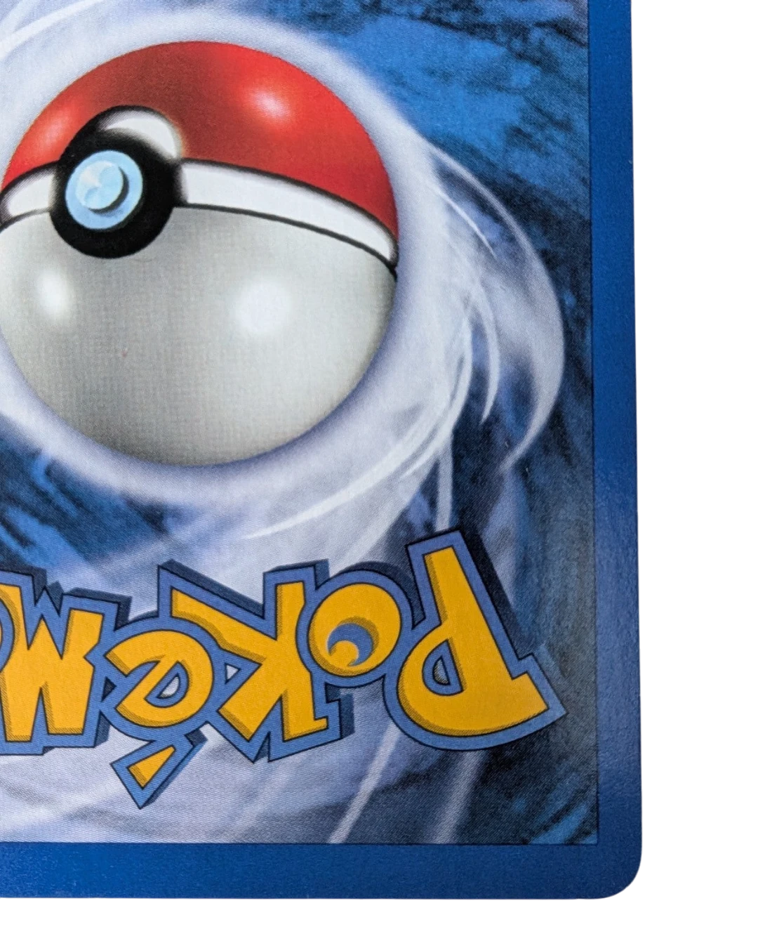 VaultifyUK vintage Pokemon TCG card back showing the classic blue and red Poke Ball design on a swirling blue background