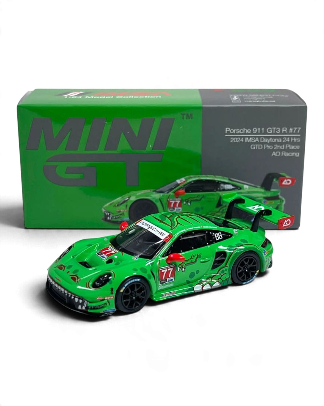 VaultifyUK MINI GT Porsche 911 GT3 R Rexy diecast model in green T-Rex livery from the 2024 Daytona 24 Hours race.