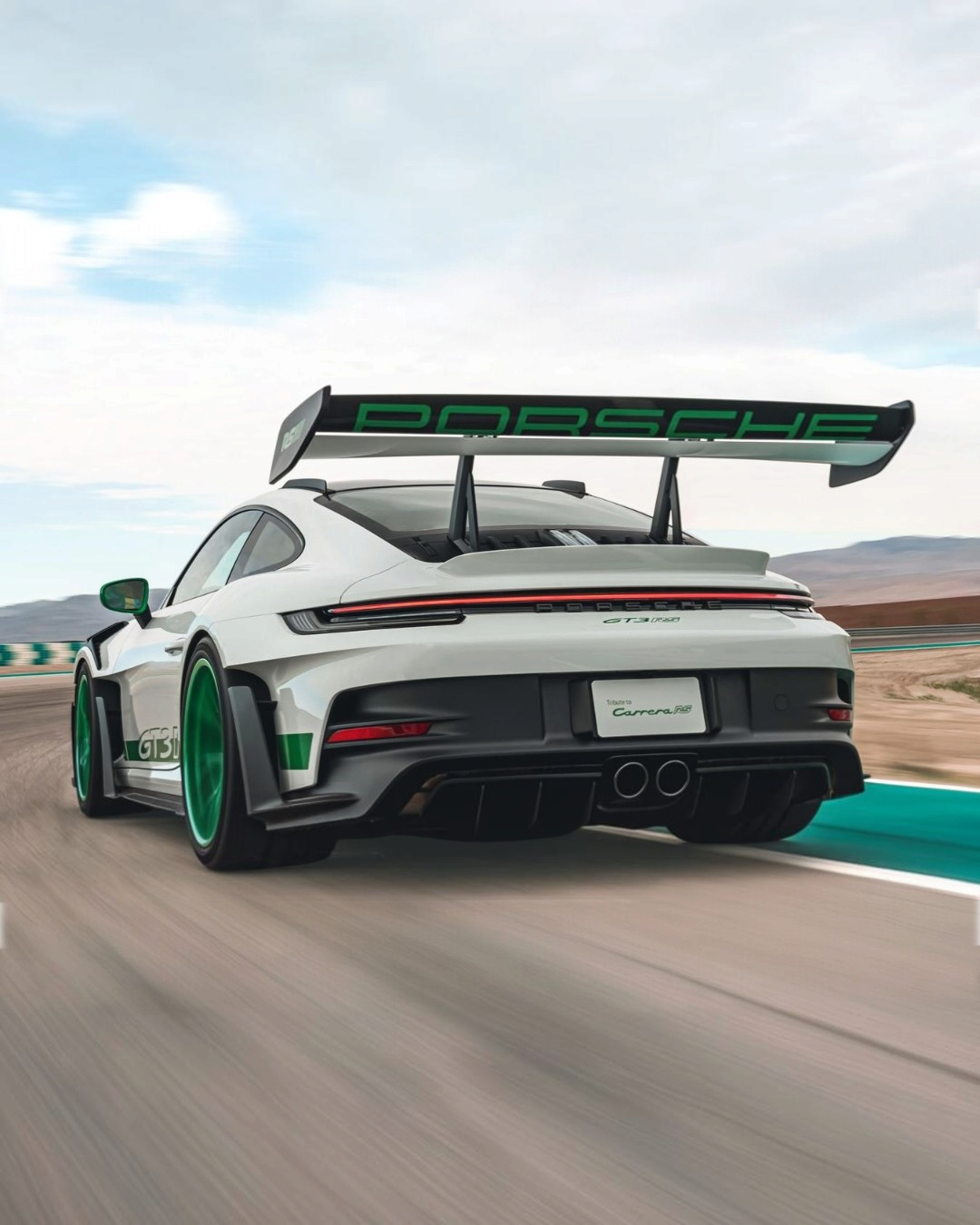 VaultifyUK Solido 1:18 scale white and Python Green Porsche 911 GT3 RS Tribute to Carrera RS model car on a track