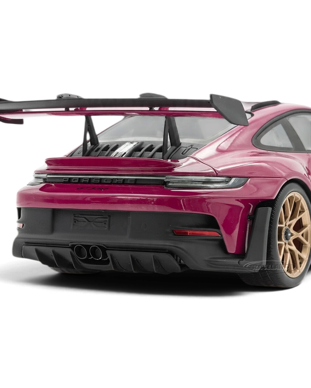 VaultifyUK Schuco 1:18 scale Porsche 911 992 GT3 RS model car in Rubystar magenta with rear wing and gold wheels