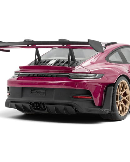 VaultifyUK Schuco 1:18 scale Porsche 911 992 GT3 RS model car in Rubystar magenta with rear wing and gold wheels