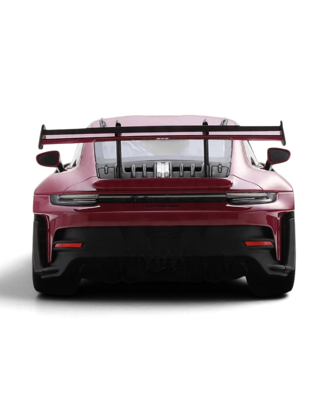 VaultifyUK Schuco 1:18 scale Porsche 911 992 GT3 RS model car in Rubystar magenta, rear view with large rear wing.