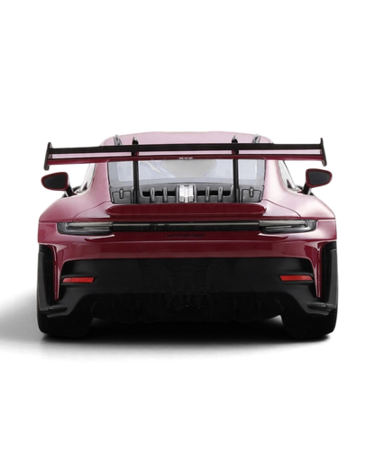 VaultifyUK Schuco 1:18 scale Porsche 911 992 GT3 RS model car in Rubystar magenta, rear view with large rear wing.