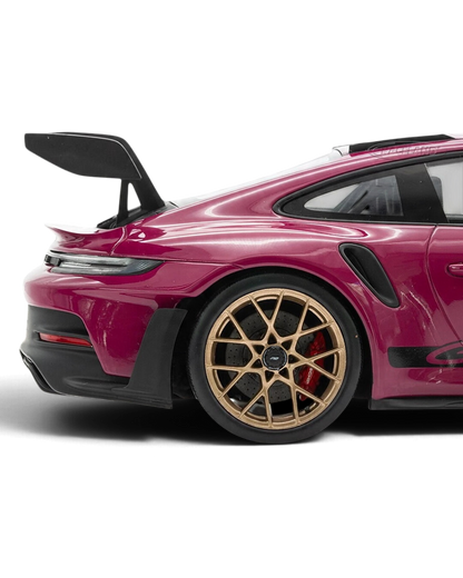VaultifyUK Schuco 1:18 scale Porsche 911 GT3 RS model car in Rubystar magenta with gold wheels and rear wing