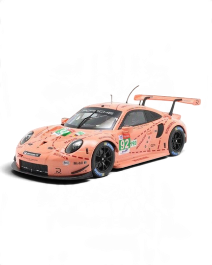 VaultifyUK 1:12 scale IXO Porsche 911 RSR Pink Pig model car featuring iconic 2018 Le Mans livery and racing details.
