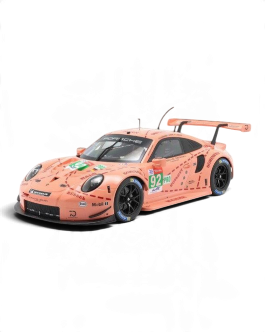 VaultifyUK 1:12 scale IXO Porsche 911 RSR Pink Pig model car featuring iconic 2018 Le Mans livery and racing details.