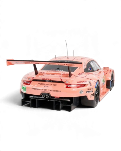 VaultifyUK 1:12 scale IXO Porsche 911 RSR Pink Pig model car, rear view showing iconic butcher-cut livery and spoiler.
