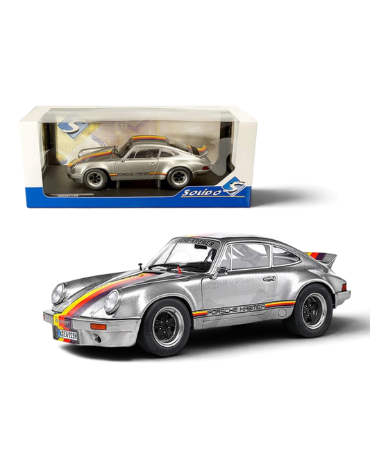 VaultifyUK 1:18 scale silver 1973 Porsche 911 RSR Kremer Rally diecast model car with racing stripes and opening doors.