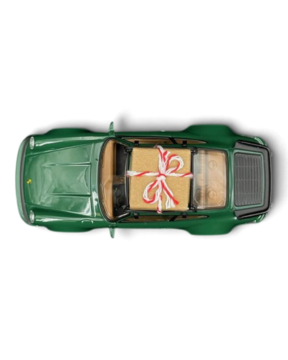 VaultifyUK Norev 1:43 scale green 1978 Porsche 911 Turbo Christmas edition model car with a gift on the roof