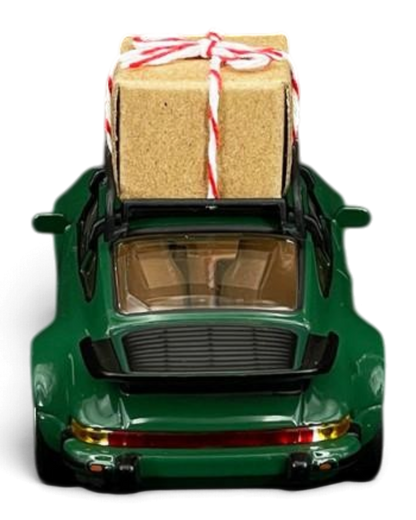 VaultifyUK 1:43 scale green Norev Porsche 911 Turbo 1978 Christmas edition model car with a gift on the roof rack