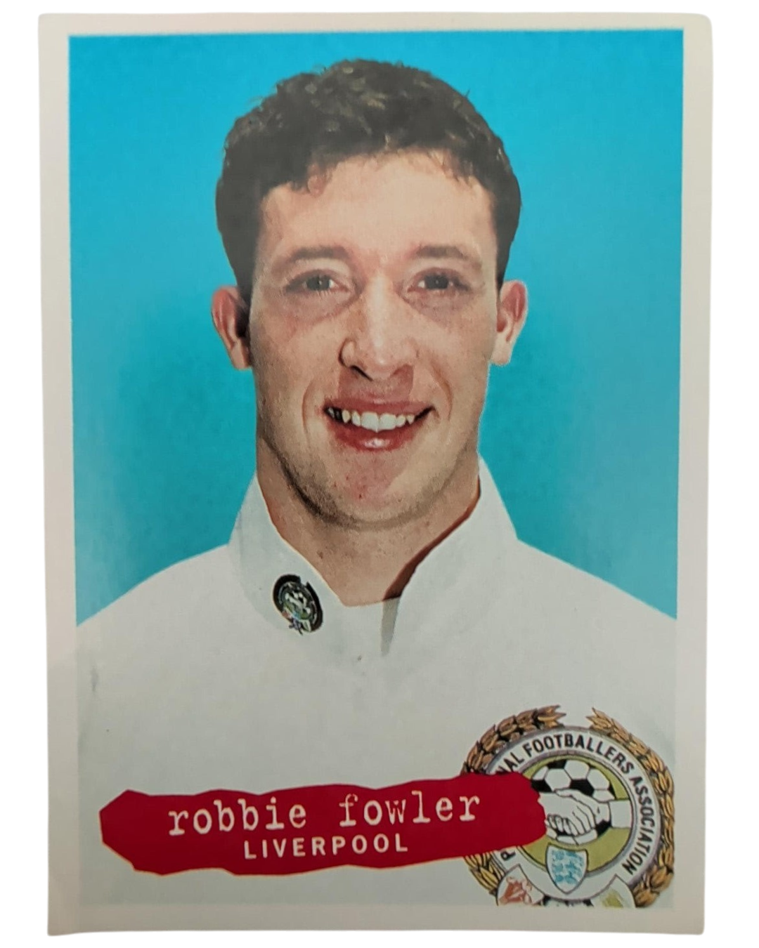 VaultifyUK 1996 Panini Robbie Fowler Liverpool football sticker featuring a portrait on a bright blue background
