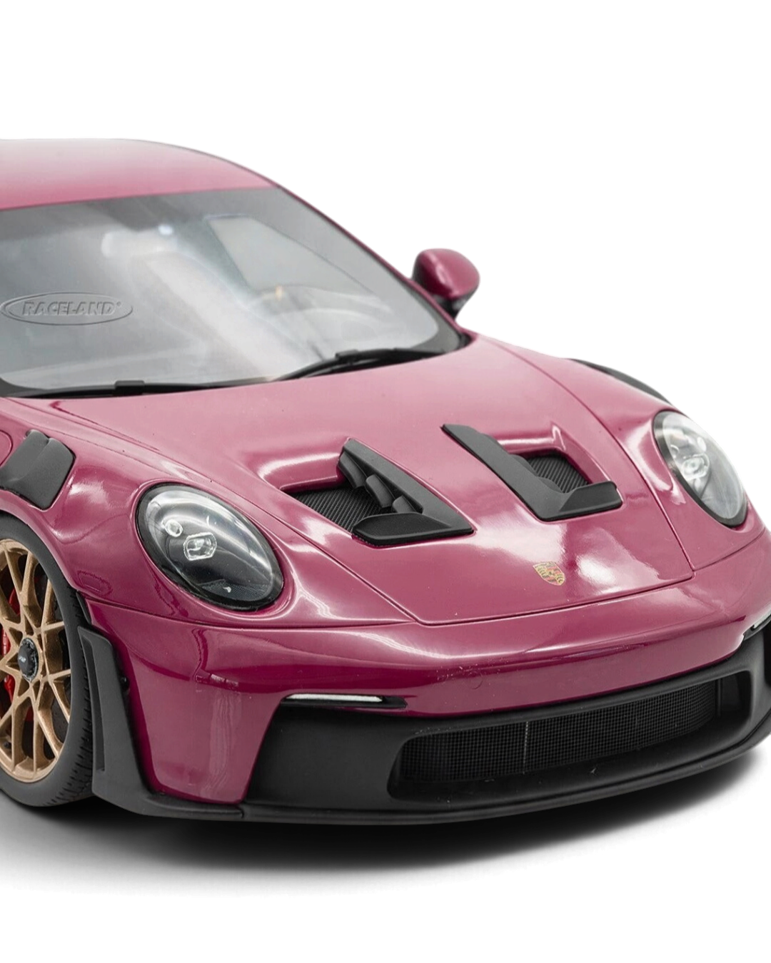 VaultifyUK Schuco 1:18 scale Porsche 911 GT3 RS model car in Rubystar magenta with gold wheels and black accents