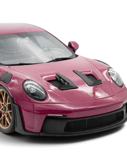VaultifyUK Schuco 1:18 scale Porsche 911 GT3 RS model car in Rubystar magenta with gold wheels and black accents