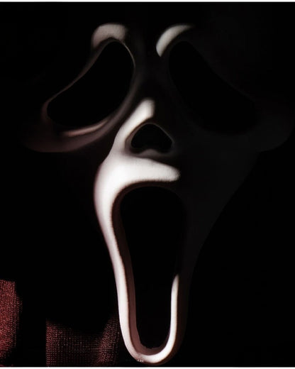 VaultifyUK Mezco Living Dead Dolls Scream Ghostface figure close-up of the iconic white mask in dramatic lighting