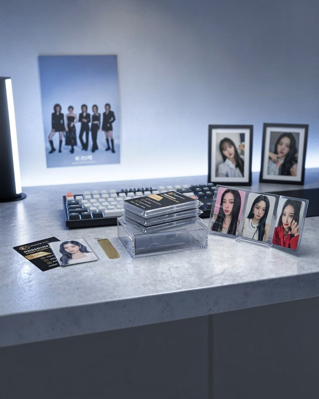 VaultifyUK Shield premium clear photocard sleeves displayed on a desk with K-Pop collectible cards and storage case.