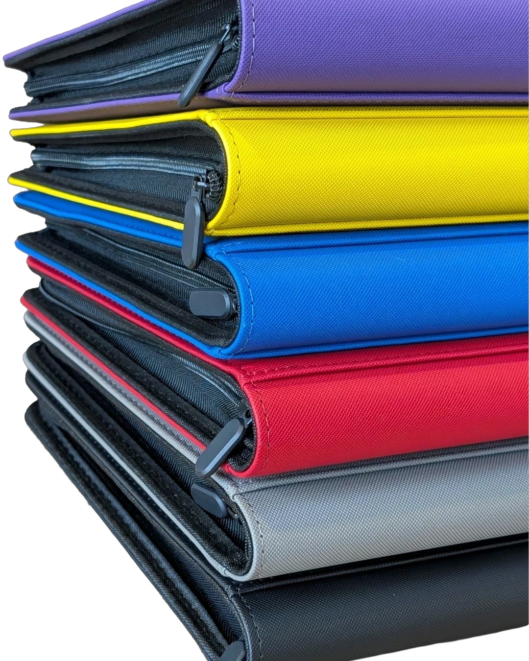 VaultifyUK Shield 9-pocket trading card binders stacked in purple, yellow, blue, red, grey, and black colors.