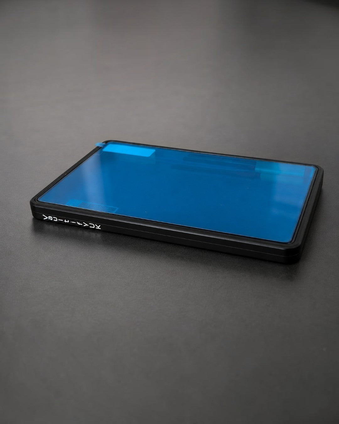 VaultifyUK Showcase aluminium BGS slab display case in black with a protective blue film on the clear viewing panel