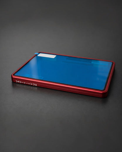 VaultifyUK Showcase red aluminium display case for PSA graded cards with a clear protective film on a dark surface