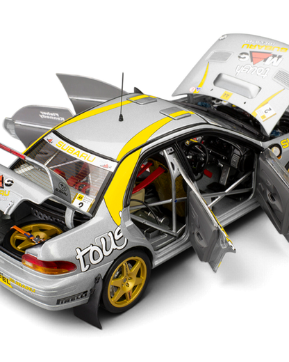 Sunstar 1:18 Subaru Impreza 555 #2 Fisher/Kennedy with doors, bonnet and boot open showing the roll cage