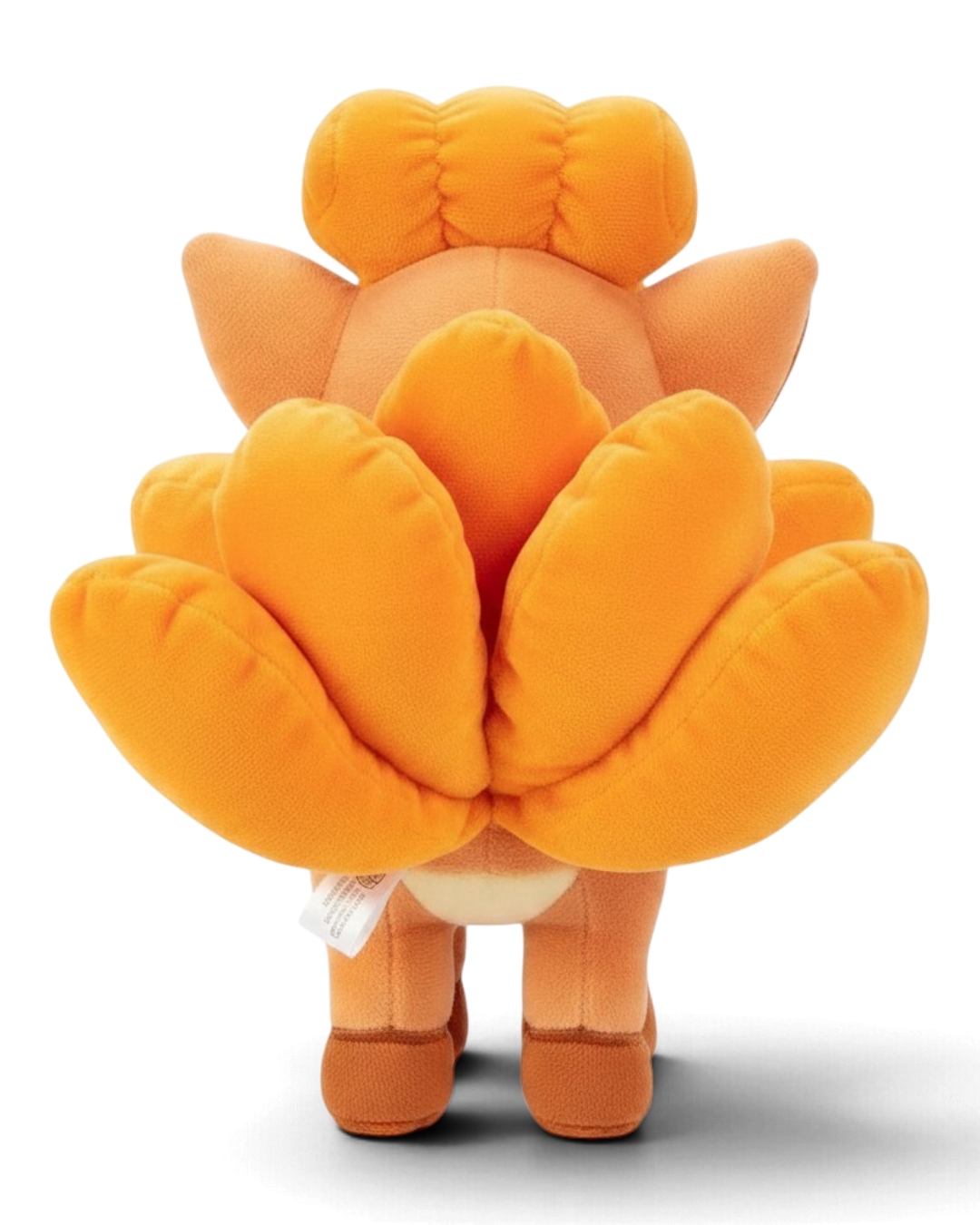 VaultifyUK 8-inch Vulpix plush toy showing the soft orange fur and detailed tail design from a back view