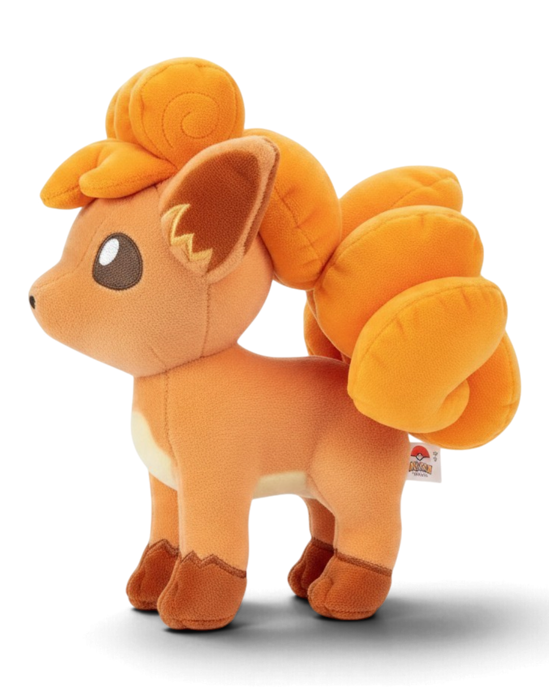 VaultifyUK 8-inch Vulpix plush toy with soft orange fabric, embroidered eyes, and detailed curled tail.