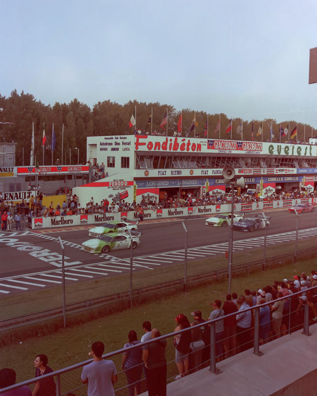 The real car: Nelson Piquet's green-and-white #5 BMW M1 Procar leading Didier Pironi's #25 in the final round of the 1980 Procar Championship at Imola