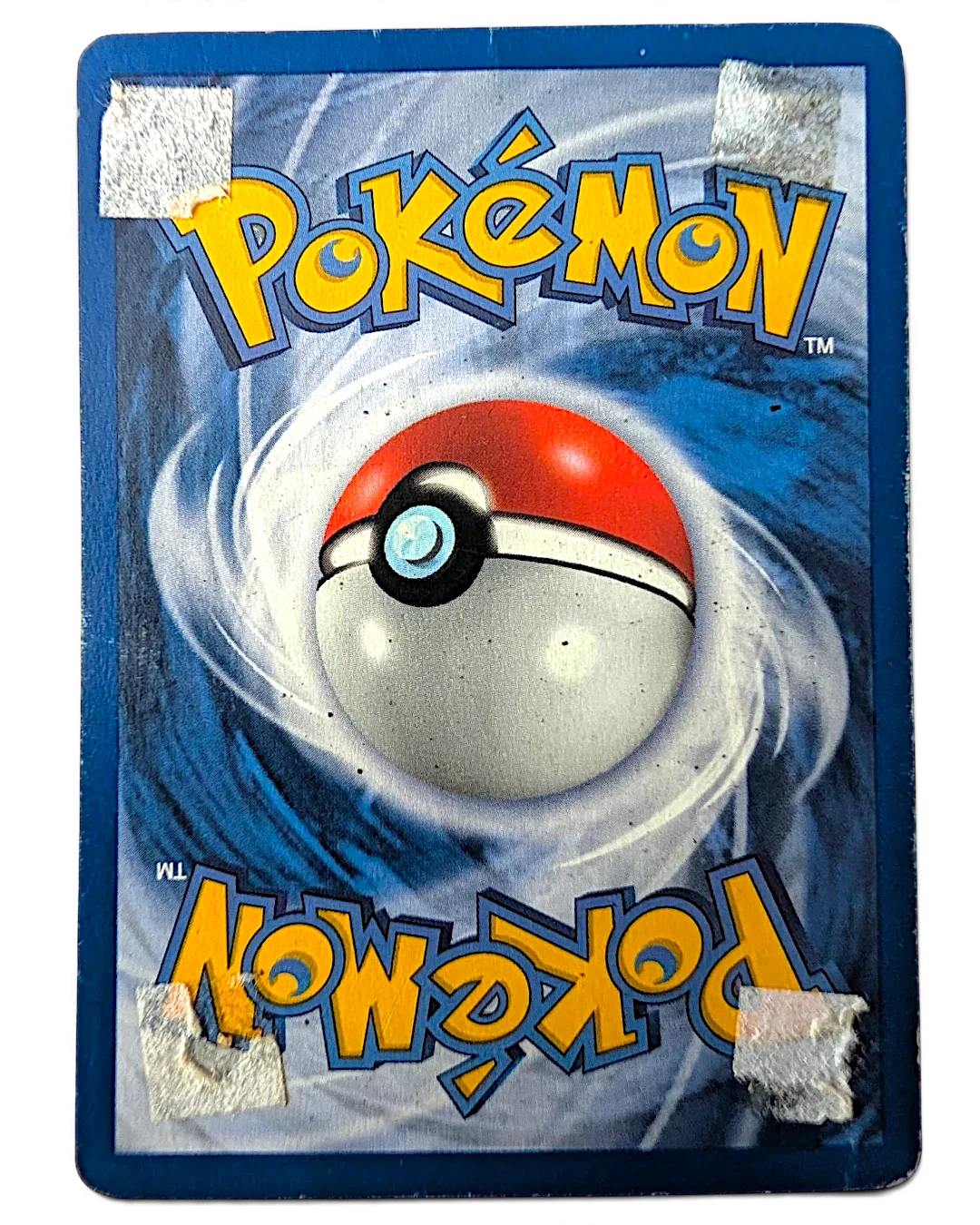 Reverse side of a damaged VaultifyUK 1999 Jungle set Wigglytuff Pokémon card showing adhesive residue and paper tears.