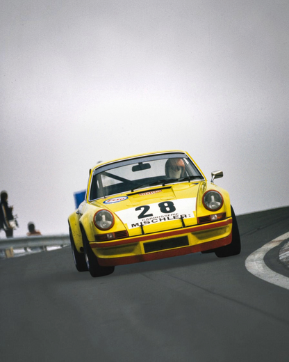 VaultifyUK 1:18 scale yellow Porsche 911 RSR race car model with number 28 livery on a track