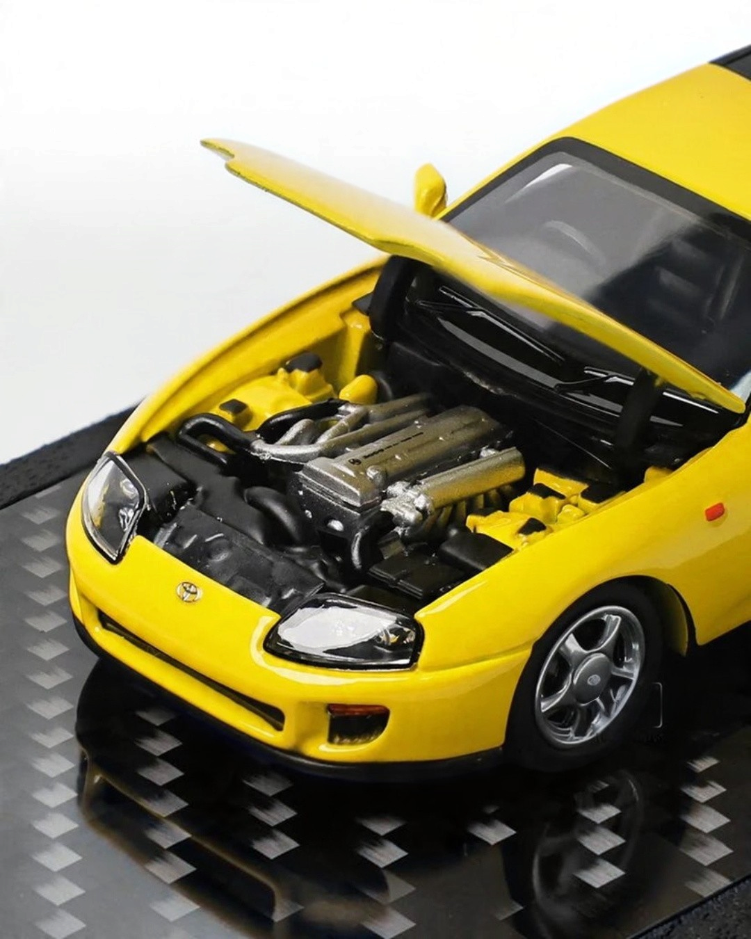 VaultifyUK 1:64 scale yellow Toyota Supra A80 diecast model with opening bonnet revealing detailed engine bay
