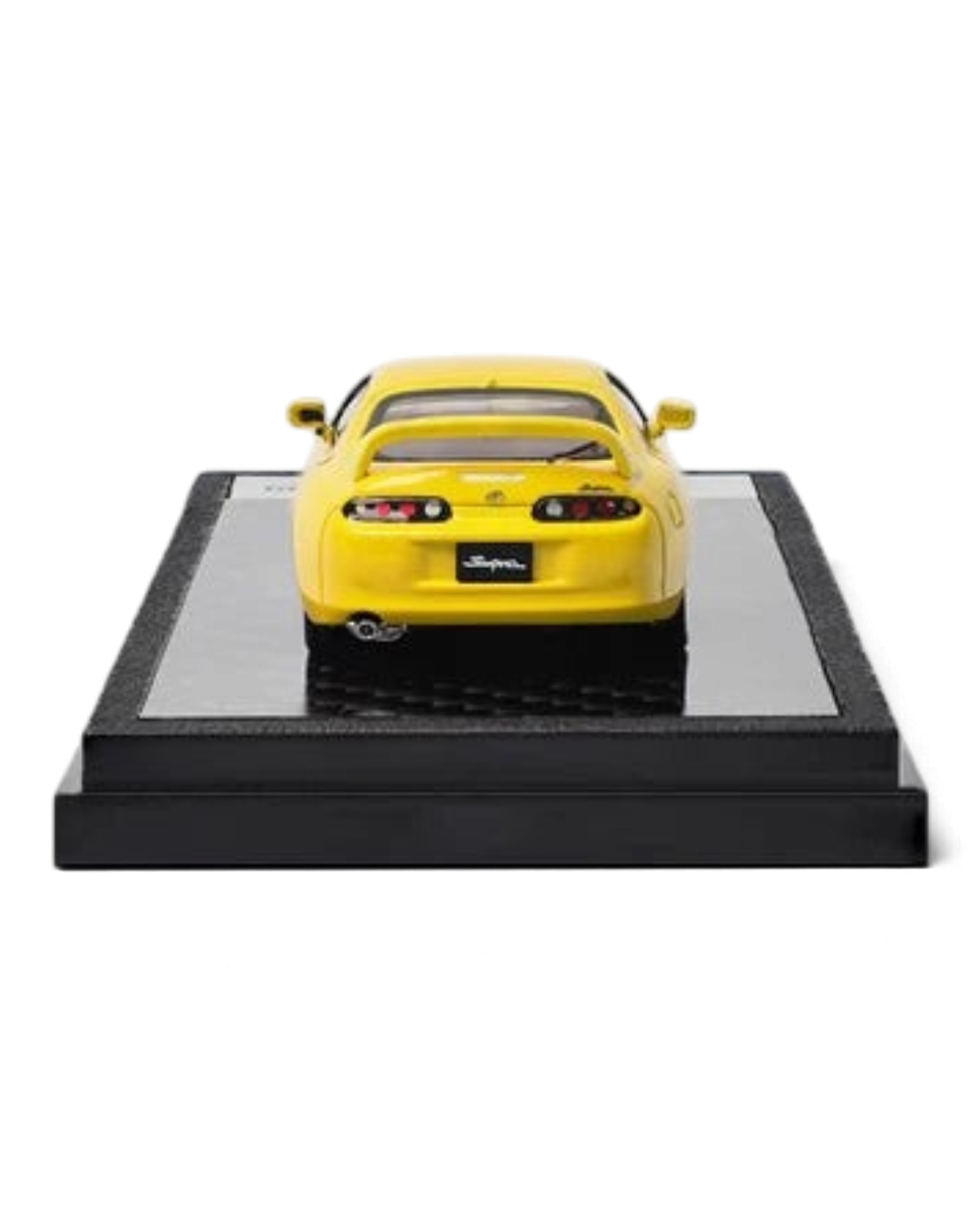 VaultifyUK yellow 1:64 scale Toyota Supra A80 diecast model car viewed from the rear on a black display base